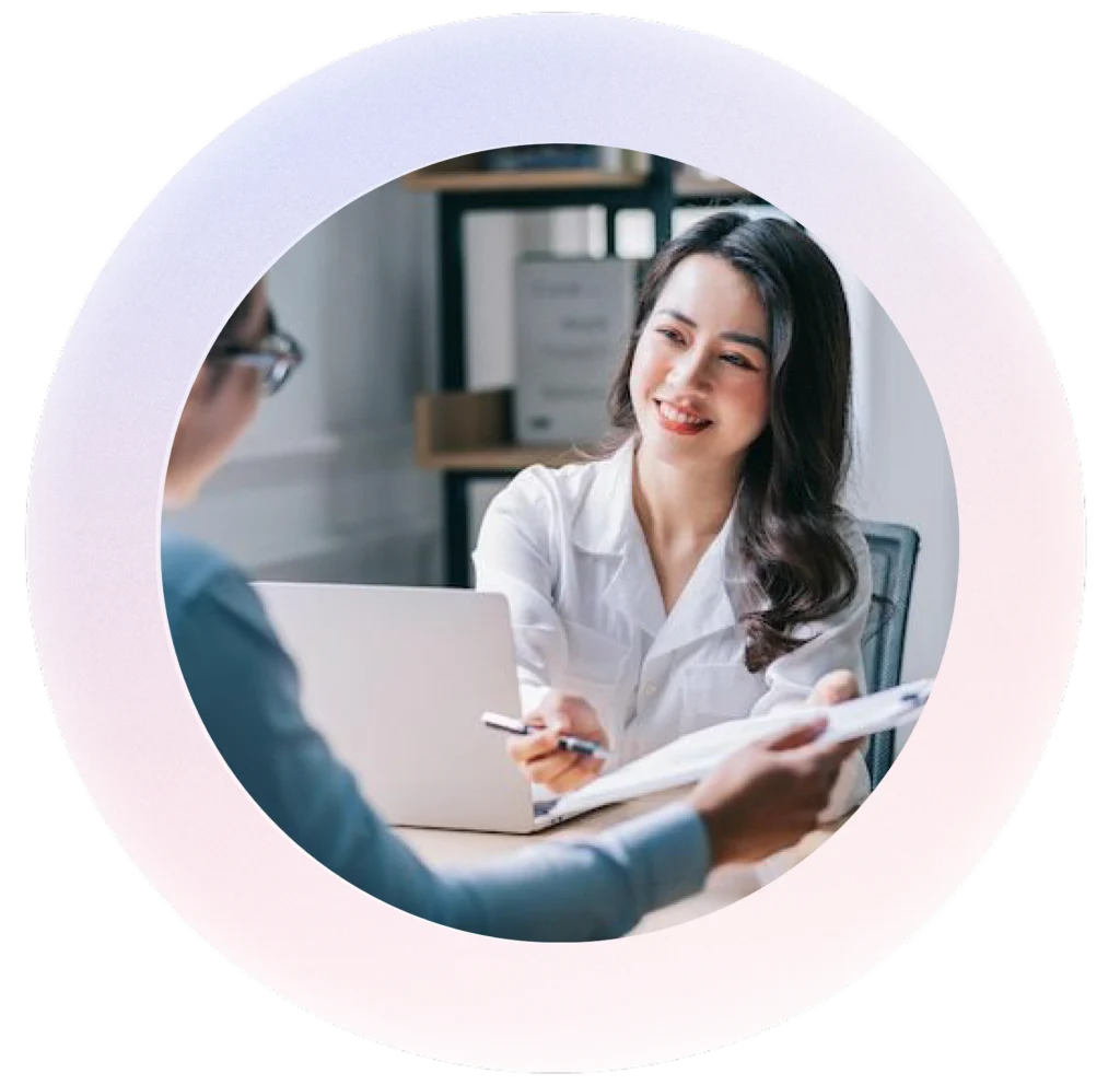 Two people in a meeting setting at a digital marketing agency in Malaysia.